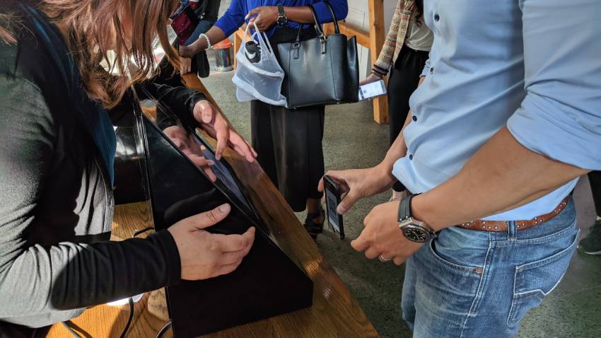 man with phone at networking event